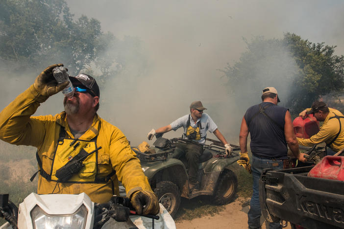 Members of a landowner-led prescribed burn association work together in south-central Nebraska to complete a 945-acre prescribed burn. Everyone on the burn performs an essential role, from the four-wheeler riding internal ignition team to the mop-up crew that patrols the perimeter with water tanks strapped to flatbed pickup trucks.