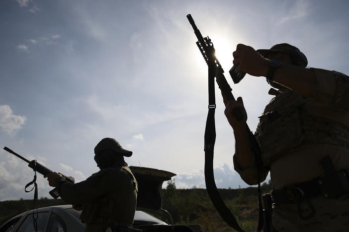 Volunteers from Belarus practice at a shooting range near Warsaw, Poland, on May 20. Belarusians are among those who have answered a call by Ukrainian President Volodymyr Zelenskyy for foreign fighters to go to Ukraine and join the International Legion for the Territorial Defense of Ukraine.