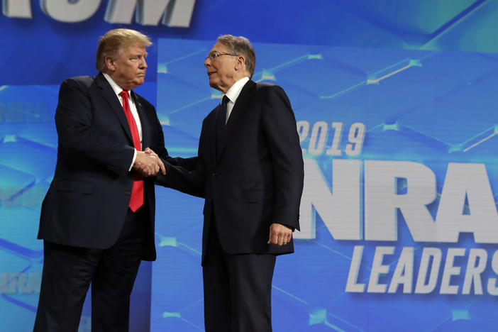 President Donald Trump shakes hands with NRA Executive Vice president and CEO Wayne LaPierre, at the annual meeting of the National Rifle Association on April 26, 2019, in Indianapolis. The NRA is going ahead with its annual meeting in Houston just days after the shooting massacre at a Texas elementary school.