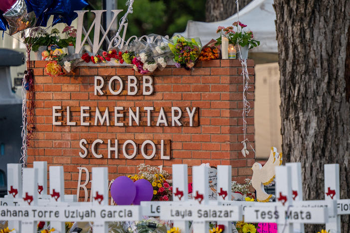 A memorial is seen outside Robb Elementary School in Uvalde, Texas, following the attack there this week in which 19 students and two adults were killed.