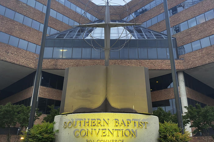 A cross and Bible sculpture stand outside the Southern Baptist Convention headquarters in Nashville, Tenn., on Tuesday. Southern Baptist leaders have released a list of hundreds of pastors and other church-affiliated personnel accused of sexual abuse.