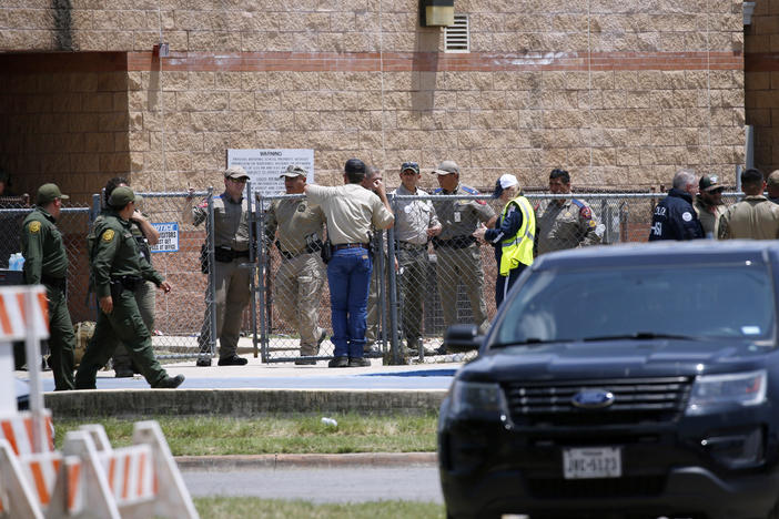 Law enforcement and first responders gather outside Robb Elementary School following Tuesday's shooting in Uvalde, Texas. Their response has since come under wide scrutiny.