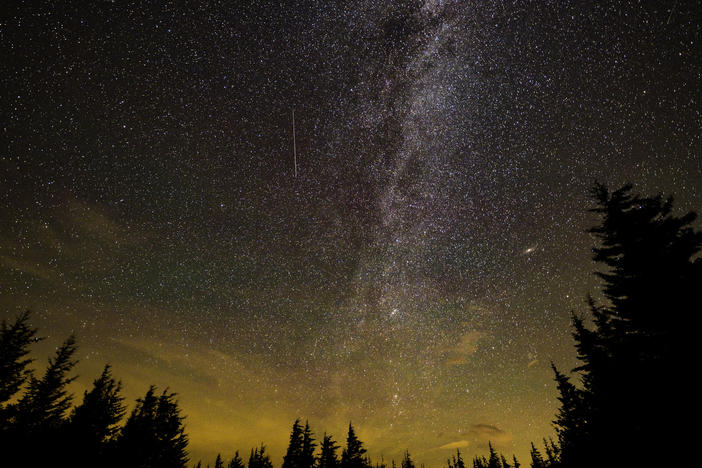 In this 30 second exposure, a meteor streaks across the sky during the annual Perseid meteor shower on Aug. 11, 2021 in Spruce Knob, W.Va.