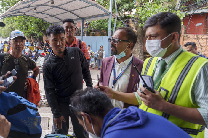A team of climbers prepare to leave for rescue operations from the Tribhuvan International Airport in Kathmandu, Nepal, Sunday, May 29, 2022, following reports of a Tara Air flight that disappeared.