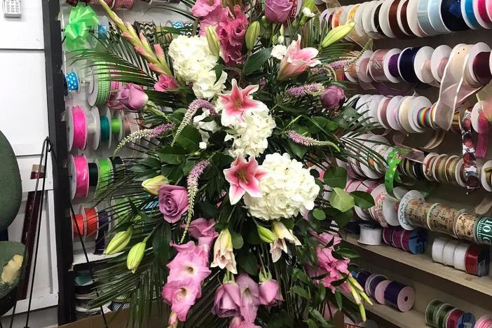 A floral arrangement honors a victim of the school shooting in Uvalde, Texas.