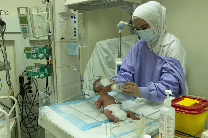 A baby receives care in the neonatal intensive care unit of the government hospital in Tripoli, Lebanon. Because of the lack of prenatal care amid the country's massive economic crisis, medical staff members say more newborns are born sick and weak. From time to time, when parents don't have the funds to pay for additional care, they go home — and leave their infant stranded at the hospital.
