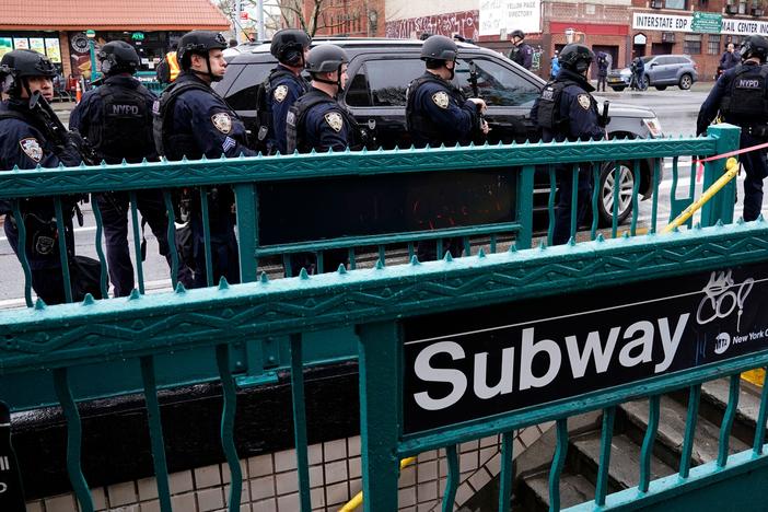 Members of the New York Police Department patrol the streets after a rush-hour shooting at a subway station in Brooklyn on April 12.