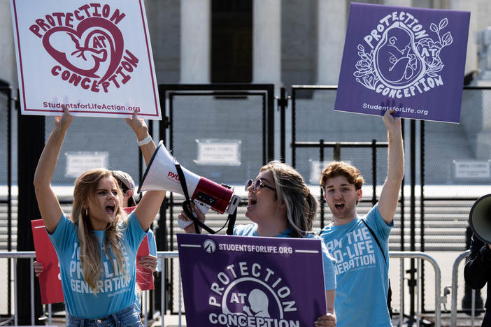 Anti-abortion activists protest outside the U.S. Supreme Court on Monday, May 23.