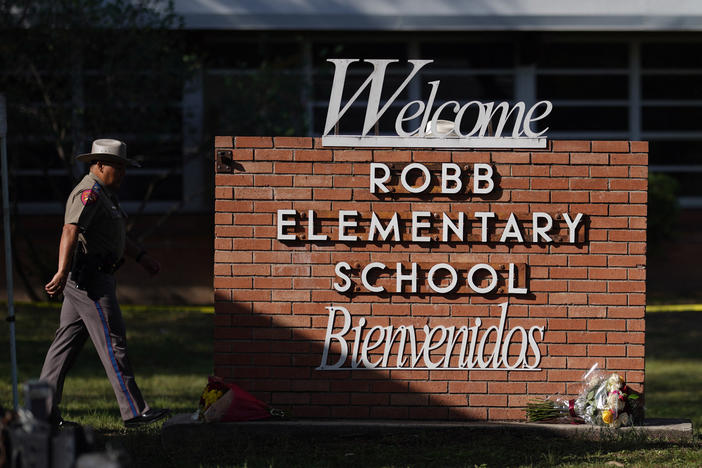 An officer walks outside of Robb Elementary School in Uvalde, Texas, on May 25.