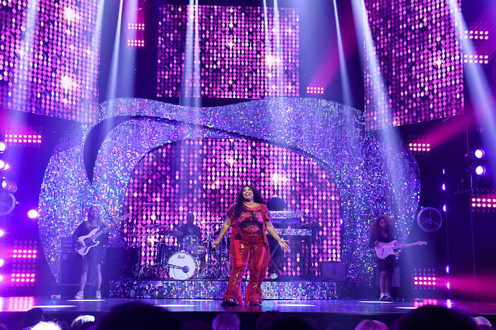 Lizzo performs onstage during the YouTube Brandcast 2022 in May.