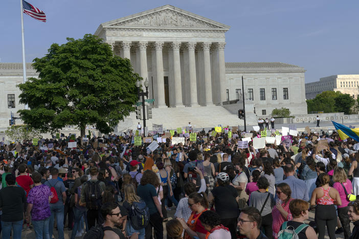 Abortion rights activists protest outside of the U.S. Supreme Court in Washington on May 3, a day after the leak of a draft opinion suggesting a possible reversal of <em>Roe v. Wade. </em>