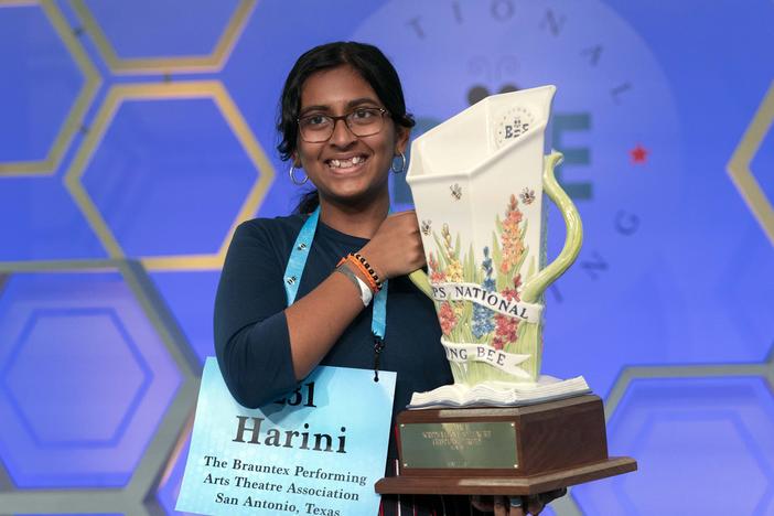 Harini Logan, 14, from San Antonio, Texas, holds her winning Scripps National Spelling Bee trophy, Thursday, June 2, 2022, in Oxon Hill, Md.