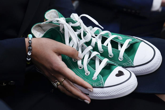 Camila Alves McConaughey holds green Converse sneakers. Uvalde, Texas, school shooting victim Maite Rodriguez, who died at age 10, was wearing green Converse shoes when she died.