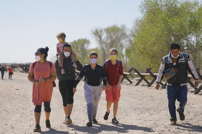 Asylum-seeking migrants from Colombia, Cuba and Venezuela arrive on U.S. soil, after crossing the Colorado River, from Mexico on Feb. 21, in Yuma, Arizona.