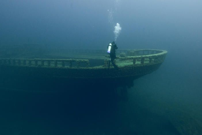 A diver explores Grecian shipwreck at Thunder Bay National Marine Sanctuary.
