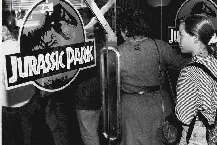 A crowd entering the theater to see <em>Jurassic Park</em>, photographed on October 5, 1993.