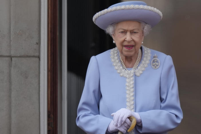 Queen Elizabeth II walks on the balcony of Buckingham Palace in London on June 2, 2022, the first of four days of celebrations to mark the Platinum Jubilee.