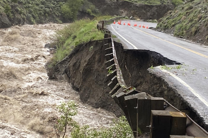 High water in the Gardiner River along the North Entrance to Yellowstone National Park in Montana washed out part of a road on Monday.