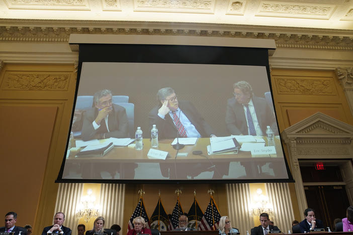 Former Attorney General Bill Barr is displayed on a screen during a hearing of the House select committee investigating the Jan. 6 Capitol attack.