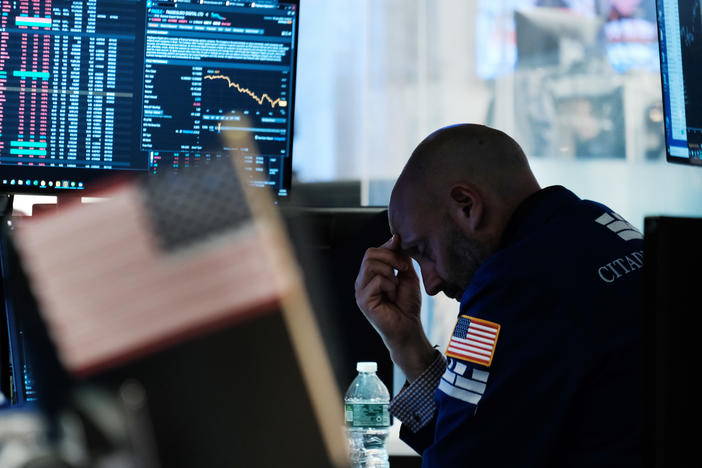 Traders work on the floor of the New York Stock Exchange (NYSE) on Friday in New York City. Stocks slumped on Monday following a stronger-than-expected report on inflation, sending the S&P 500 to a bear market.