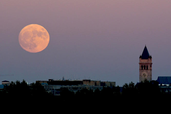 A supermoon rises over Washington, D.C., in November 2016. After this week's Strawberry Supermoon, there will be two more in July and August.