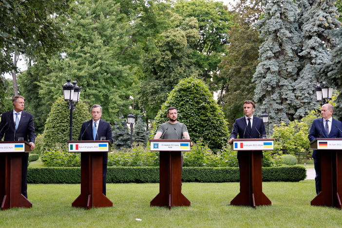 From left, Romanian President Klaus Iohannis, Prime Minister of Italy Mario Draghi, Ukrainian President Volodymyr Zelenskyy, France's President Emmanuel Macron and German Chancellor Olaf Scholz attend a press conference in Kyiv on Thursday. The French, German, Italian and Romanian leaders vowed to back Kyiv's bid to become an official candidate to join the European Union.