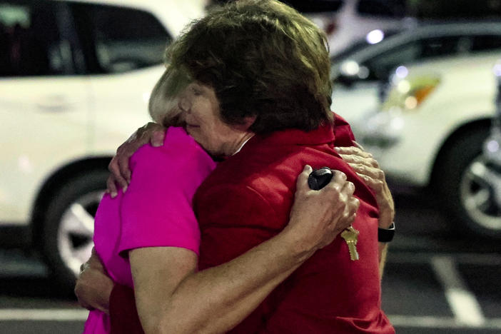 Church members console each other after a shooting at the Saint Stevens Episcopal Church on Thursday, June 16, 2022 in Vestavia, Ala.