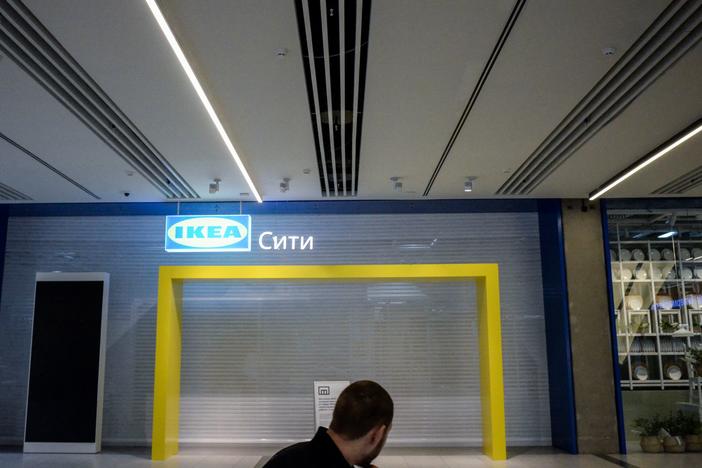 A man walks past the closed Ikea shop at a Moscow shopping mall on April 11.