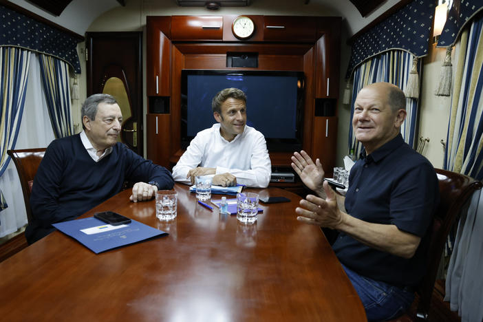 French President Emmanuel Macron (center), German Chancellor Olaf Scholz (right), and Italian Prime Minister Mario Draghi travel on board a train bound to Kyiv after departing from Poland. The three leaders are meeting with Ukraine's President Volodymyr Zelenskyy on Thursday to talk about the war in Ukraine.