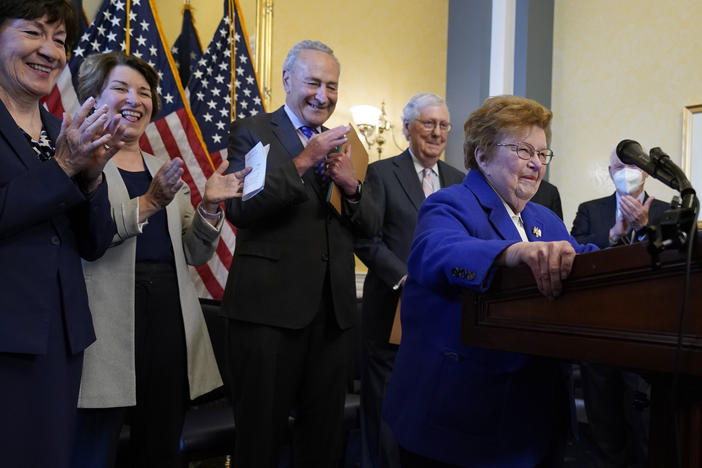 Former Sen. Barbara Mikulski, D-Md., surrounded by senators, jokes about having a podium her size during the room dedication ceremony in Washington, D.C., on Wednesday. She retired in 2017 after 45 years in Congress.