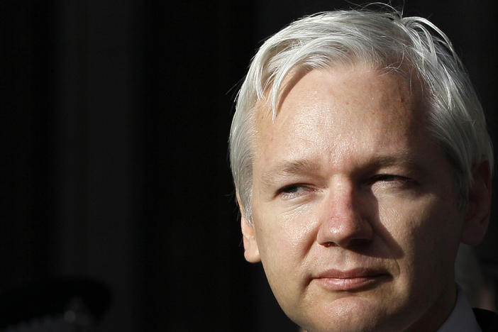 WikiLeaks founder Julian Assange pauses as he makes a statement to media gathered outside the High Court in London in 2011.