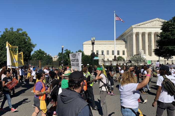 Abortion rights supporters march to the Supreme Court as part of a rally pegged to the Juneteenth holiday weekend.