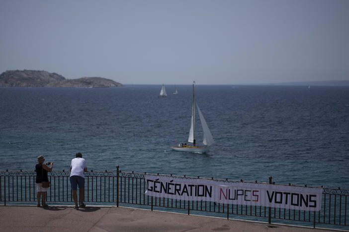 A sign reading "generation NUPES go vote" hangs on the Corniche Kennedy in Marseille, southern France, Friday, June 17, 2022.