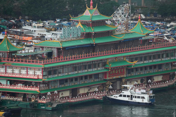 Hong Kong's iconic Jumbo Floating Restaurant is towed away in Hong Kong on June 14. It capsized at sea less than a week later.