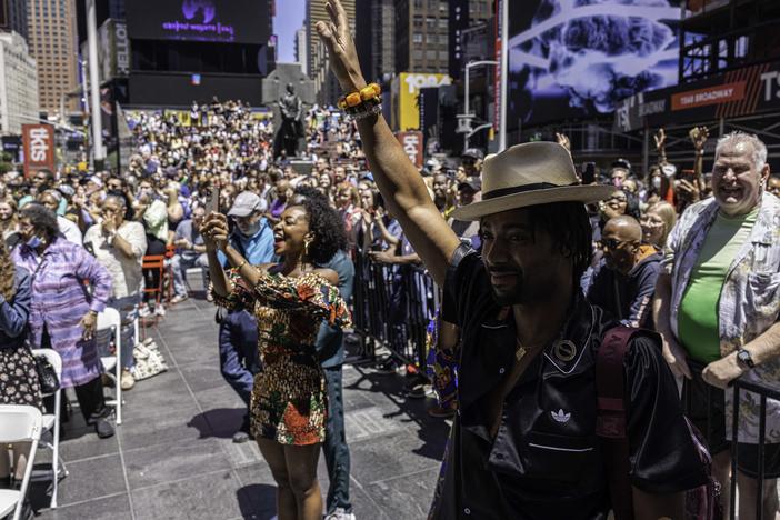 Onlookers react to a performance during a Juneteenth celebration in Times Square, in the Manhattan borough of New York, on Sunday.