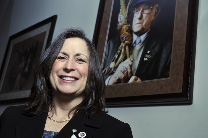 Marilynn Malerba stands next to a photograph of late Chief Ralph Sturges at tribal offices in Uncasville, Conn., on March 4, 2010. On Wednesday, President Biden announced his intent to appoint her U.S. treasurer in a historic first.