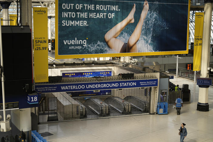An entrance to Waterloo underground station stands shuttered closed for strike action in Waterloo railway station, in London, Tuesday, June 21, 2022.