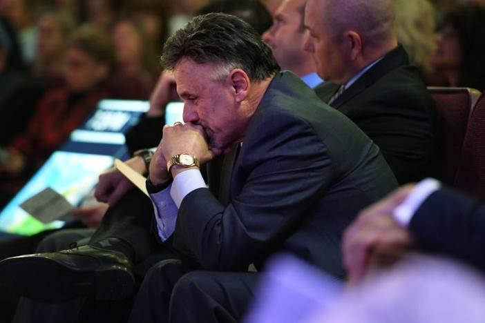 Columbine Principal Frank DeAngelis listens to his students, survivors of the shooting, in April 2019 as he attends "Columbine 20 Years Later: A Faith-based Remembrance Service" at Waterstone Community Church in Littleton, Colo. A dozen students and one teacher were massacred by two heavily armed students.
