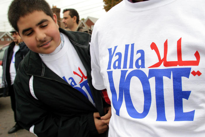 Volunteers take part in a 2004 voter outreach event in Dearborn, Mich., organized by the Arab American Institute. While there is no federal requirement for Arabic-language ballots, the city of Dearborn recently started requiring election materials to be translated into Arabic.