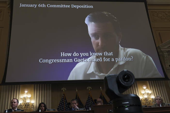 A video displays a discussion about presidential pardons on Thursday during the fifth hearing by the House Select Committee to Investigate the January 6th Attack on the U.S. Capitol.