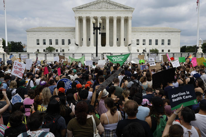 Thousands of abortion-rights activists gather in front of the U.S. Supreme Court after it overturned the landmark <em>Roe v Wade</em> case and erased a federal right to an abortion.