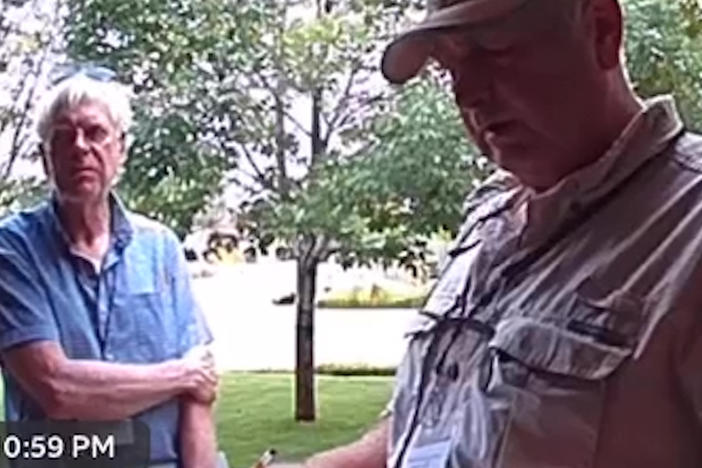 Two canvassers are seen last year on Michelle Garcia's front-door camera in in Pueblo, Colo. The men said they were "doing a voter verification project."