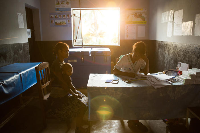 A patient talks with a nurse at a traveling contraception clinic in Madagascar run by MSI Reproductive Choices, an organization that provides contraception and safe abortion services in 37 countries. The group condemned the overturn of <em>Roe v. Wade</em> and warned that the ruling could stymie abortion access overseas.