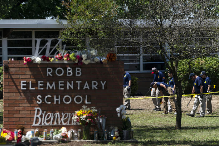 Investigators search for evidences outside Robb Elementary School in Uvalde, Texas on May 25, 2022.