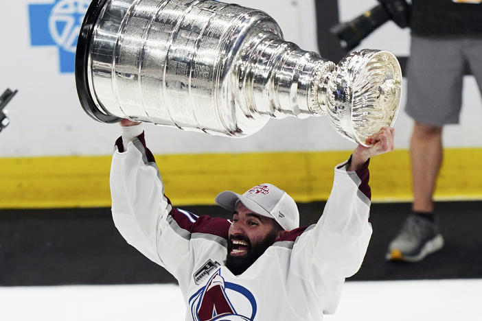 Colorado Avalanche center Nazem Kadri lifts the Stanley Cup after the team defeated the Tampa Bay Lightning 2-1 in Game 6 of the NHL hockey Stanley Cup Finals on Sunday, June 26, 2022, in Tampa, Fla.