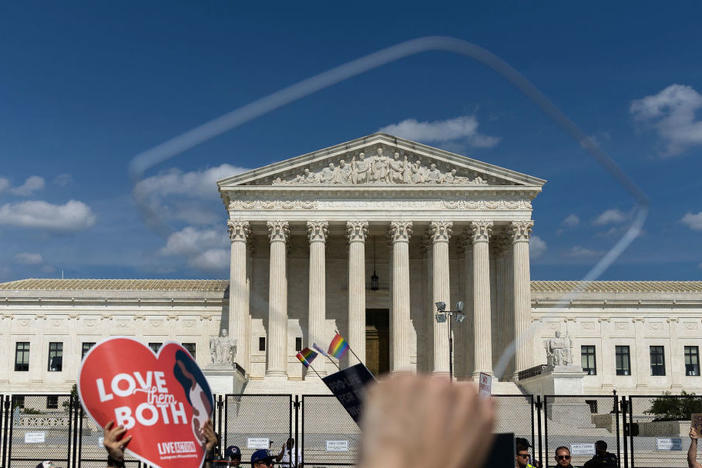Abortion-rights protesters and anti-abortion protesters gather Sunday outside the U.S. Supreme Court in Washington.