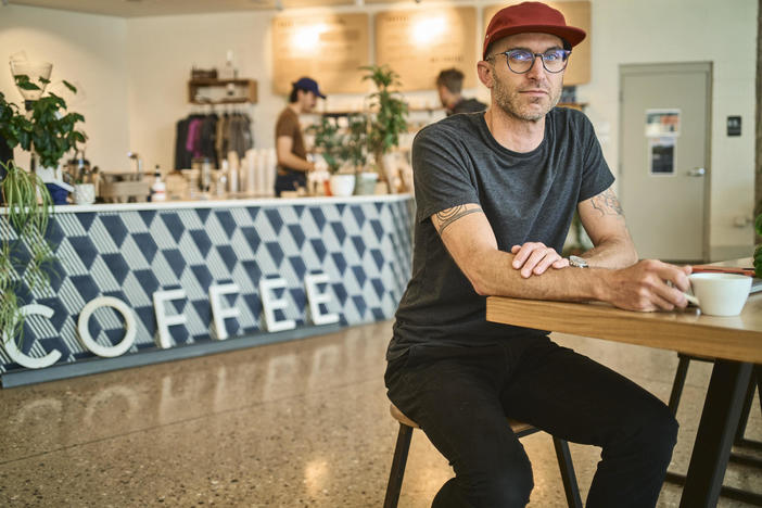 Scott Lucey, owner of Likewise Coffee whose staff unionized in 2020, sits for a portrait on June 9, 2022 in Milwaukee.