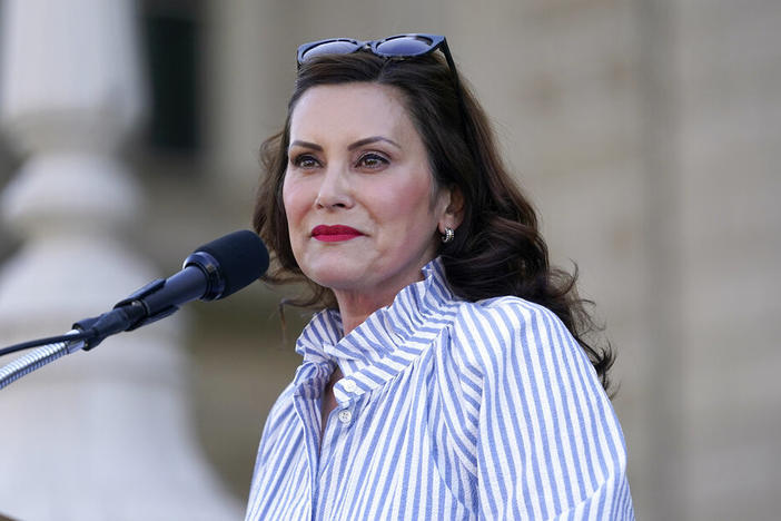 Gov. Gretchen Whitmer speaks to abortion-rights protesters Friday at a rally outside the state capitol in Lansing, Mich., following the Supreme Court's decision to overturn <em>Roe v. Wade.</em>