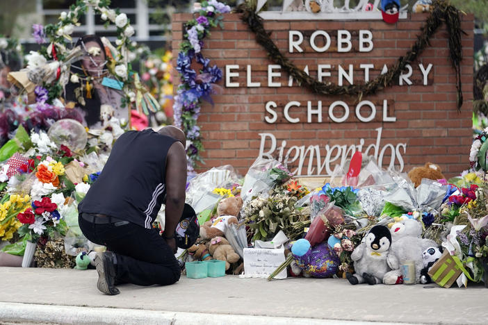 Reggie Daniels pays his respects at a memorial at Robb Elementary School in Uvalde, Texas, on June 9, 2022, honoring the two teachers and 19 students killed in the shooting at the school on May 24.