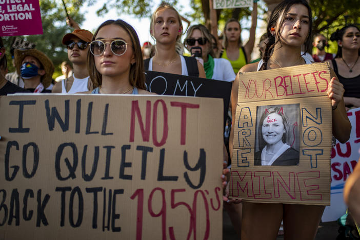 Protesters hold up signs during an abortion-rights rally on Saturday in Austin, Texas.